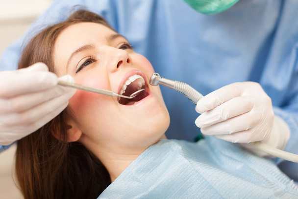 Dentist doing dental treatment on patient - Fotografie, Obrázek