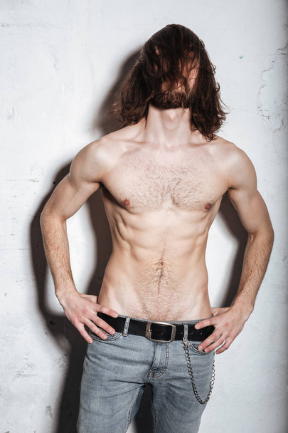 Attractive young bearded hipster man posing - Fotó, kép