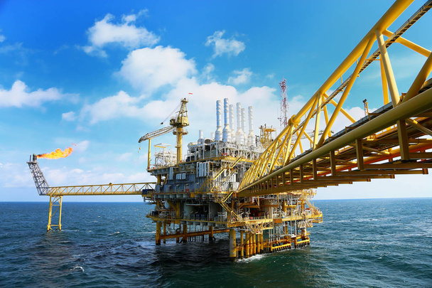 Offshore construction platform for production oil and gas. Oil and gas industry and hard work industry. Production platform and operation process by manual and auto function from control room. - Photo, Image