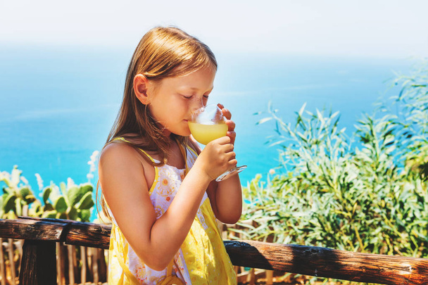 Little girl drinking traditional southern Italian lemon juice - Photo, Image