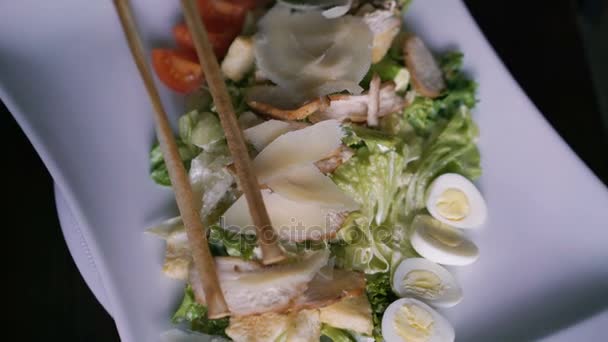 Close up of dish of seafood rotates on plate 4K - Metraje, vídeo