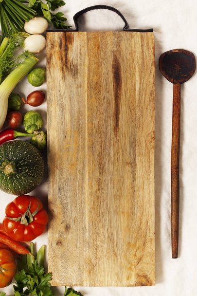 Vegetables, herbs, spices and empty cutting board - Φωτογραφία, εικόνα