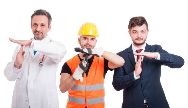 Cheerful men doing time out gesture - Photo, Image