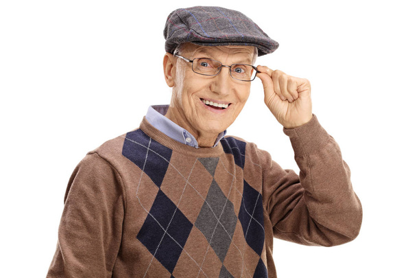 Elderly man smiling and looking at the camera - Fotó, kép