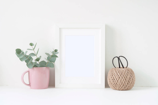 Styled composition with white frame and pink ranunculos - Foto, Imagen