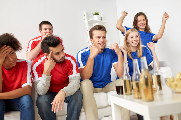friends or football fans watching soccer at home - Foto, Imagem
