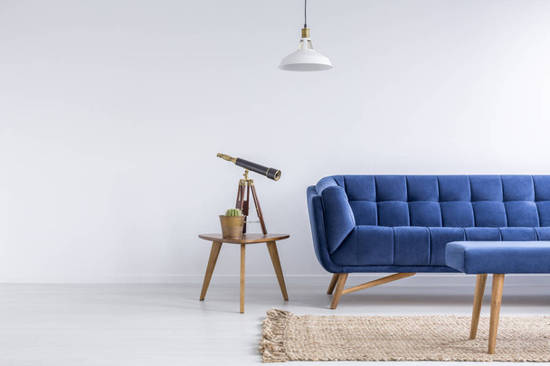 Bright apartment with blue sofa - 写真・画像
