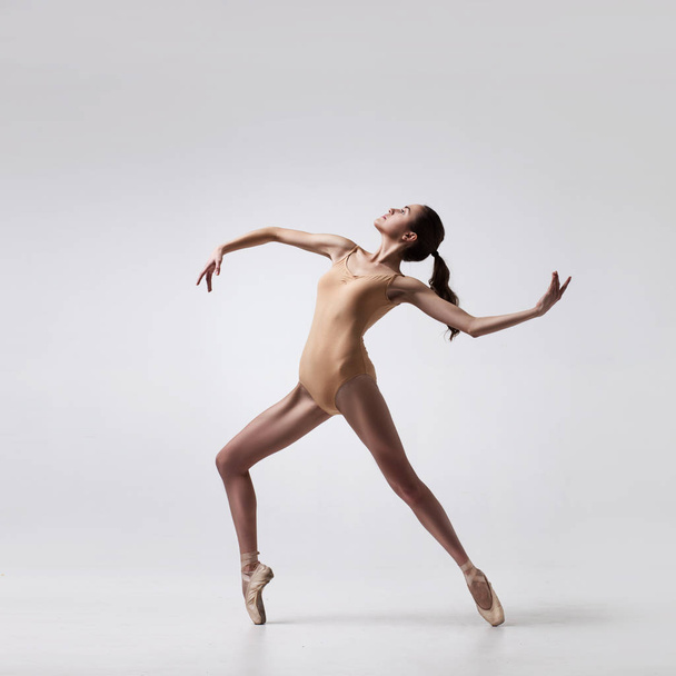 young beautiful ballet dancer in beige swimsuit - Photo, Image