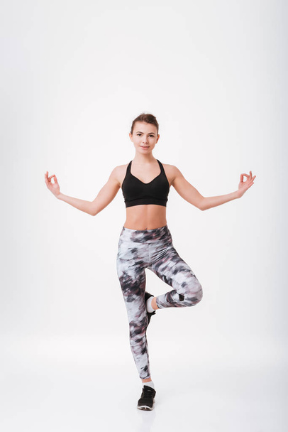 Young fitness lady make sport exercises - Valokuva, kuva