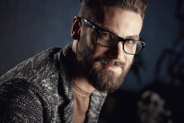Closeup portrait of handsome smiling young man with beard in glasses  - Fotoğraf, Görsel