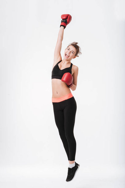 Pretty young boxer woman jumping - Fotografie, Obrázek