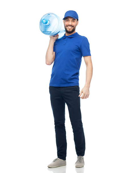 happy delivery man with bottle of water - Foto, Imagen
