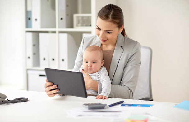 businesswoman with baby and tablet pc at office - Photo, Image