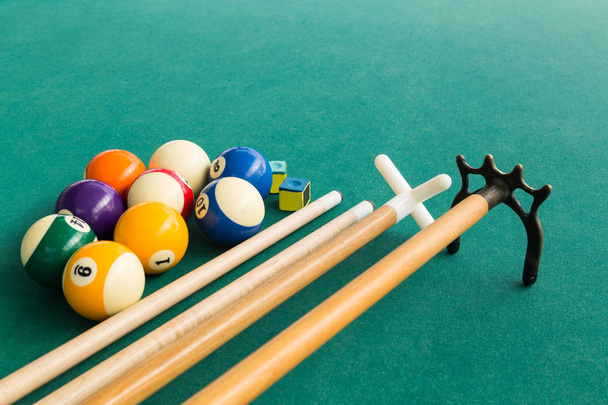 Closeup of snooker billards balls, chalk, cue and extender stick - Photo, Image