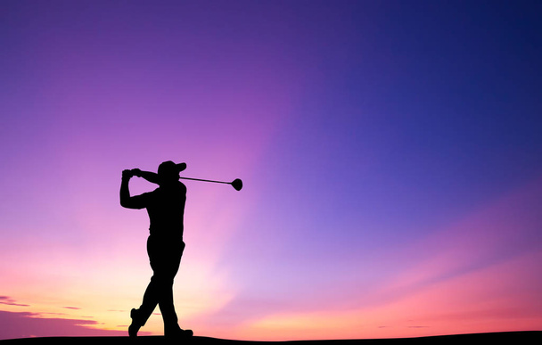 silhouette golfer playing golf during beautiful sunset - Photo, Image