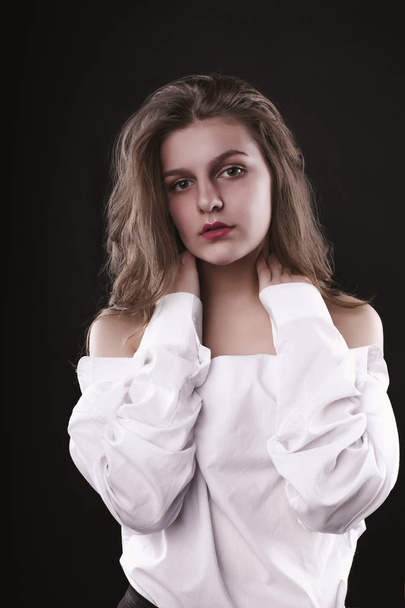 Fashionable young woman with lush hair wearing white shirt - Photo, image