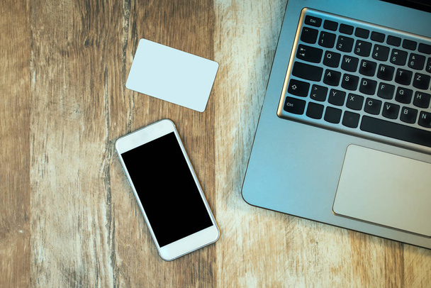Laptop, smart phone and business card, top view mock up - Fotó, kép