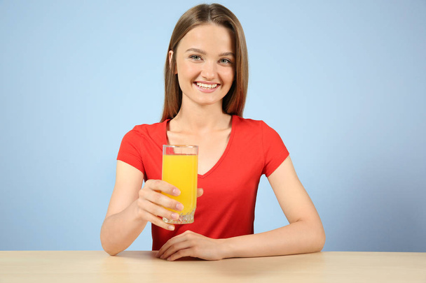 Young woman with glass of fresh juice  - Фото, зображення
