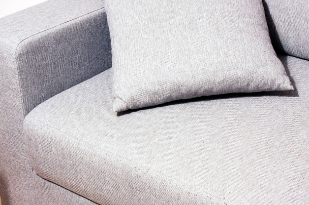 Grey sofa with cushion - Valokuva, kuva