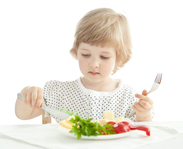 Little girl eating her dinner - 写真・画像