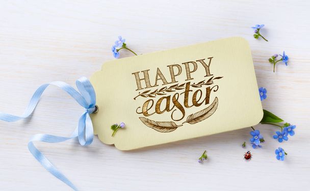 Easter card and spring flovers on wood background  - Photo, Image