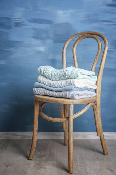 Pile of clothes on chair - Φωτογραφία, εικόνα