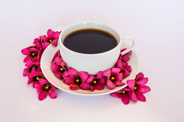 Cup of coffee with flowers - Fotoğraf, Görsel