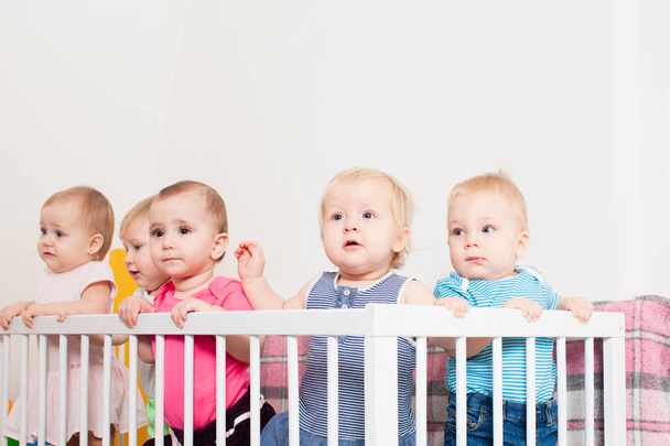 Babies in the crib - Фото, изображение