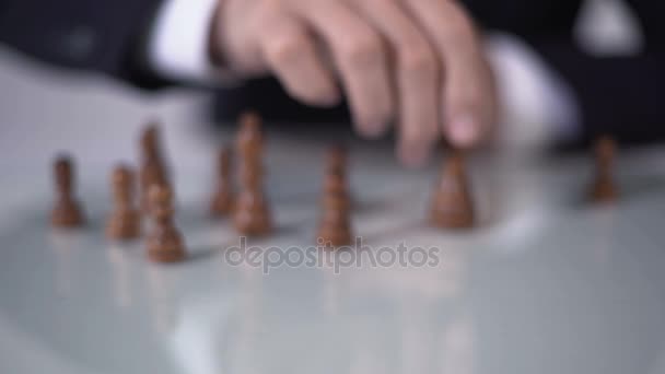 Man making winning queen move in chess game, using successful business strategy - Footage, Video