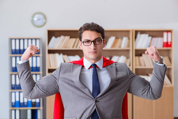 Superhero businessman working in the office - Photo, Image