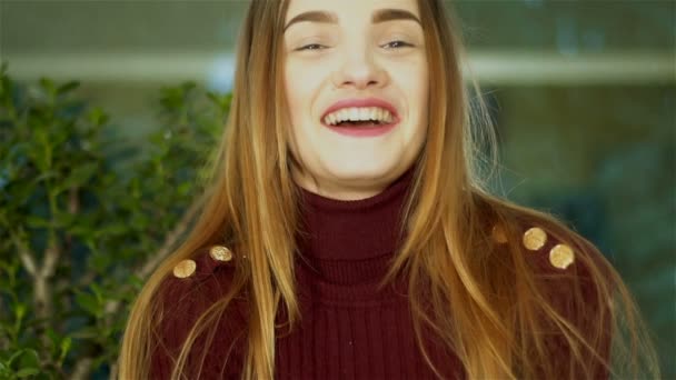 cutie young lady with nice make up looking at the camera and laughing at home - Záběry, video