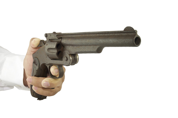 hand afvuren van een pistool - Foto, afbeelding