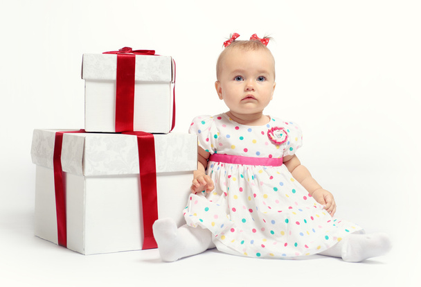 Adorable baby girl with two gift boxes - Foto, afbeelding