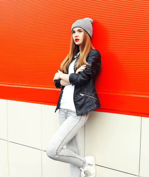 Fashion stylish pretty woman wearing a rock black jacket and hat - Фото, изображение