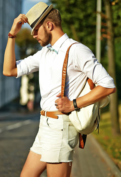 Handsome hipster model man in stylish summer clothes - Фото, изображение