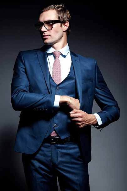  handsome businessman male model in blue suit  posing in studio - Φωτογραφία, εικόνα