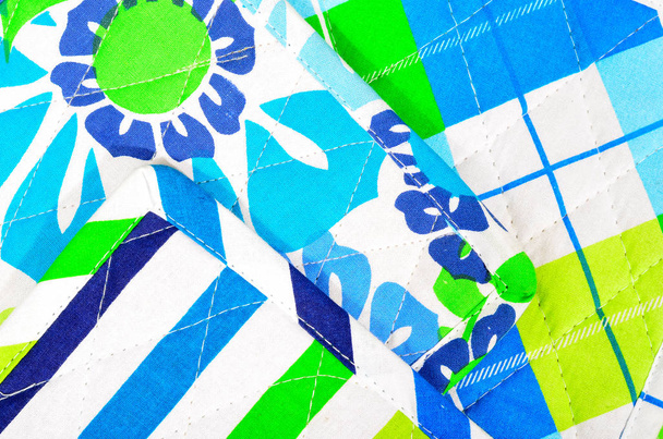 Blue and neon yellow potholders as background.  - Foto, immagini
