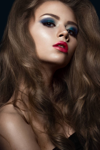 Beautiful girl in Hollywood manner with curls, red lips and blue make-up. Beauty face and hair. - Fotografie, Obrázek