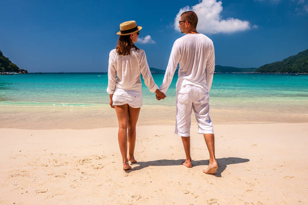 Couple in white on beach - Photo, image