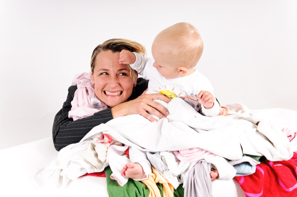 Mother and her son doing laundry - Photo, Image