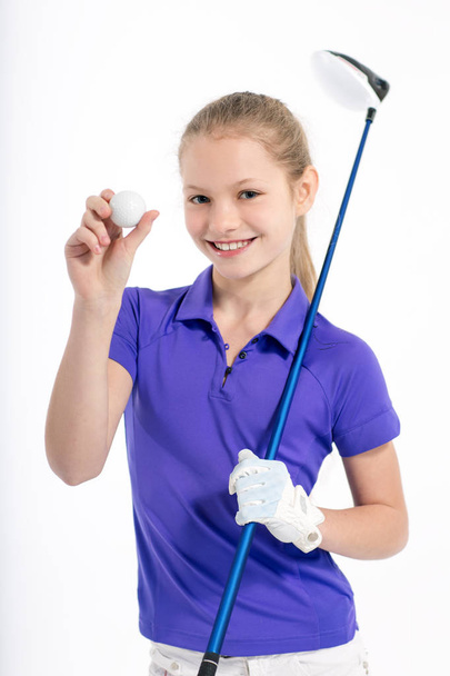 Pretty girl golfer on white backgroud in studio - Fotó, kép