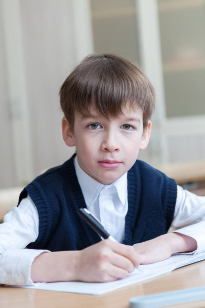 Diligent student sitting at desk, classroom - Foto, Imagem