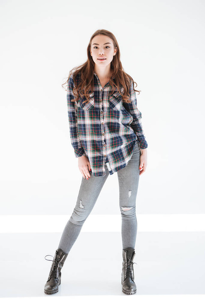 Full length of attractive woman in plaid shirt and jeans - Foto, Bild