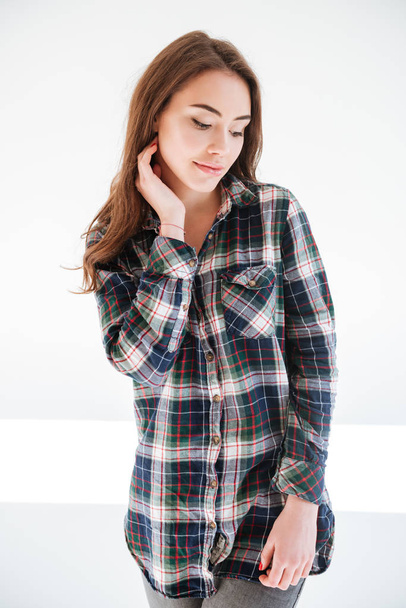 Beautiful sensual young woman in plaid shirt standing and smiling - Φωτογραφία, εικόνα