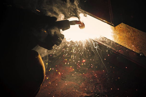 Welder brews metal sparks fly - Photo, Image