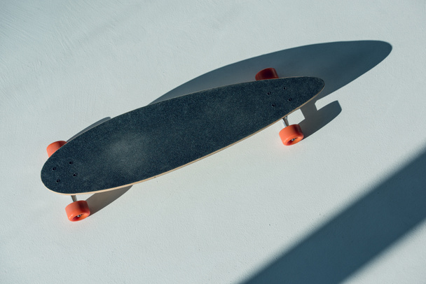 skateboard with orange wheels - Fotó, kép