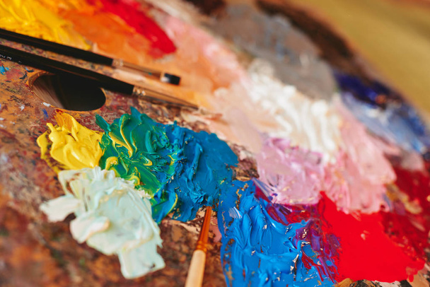 Artist palette with paint brushes - Photo, Image