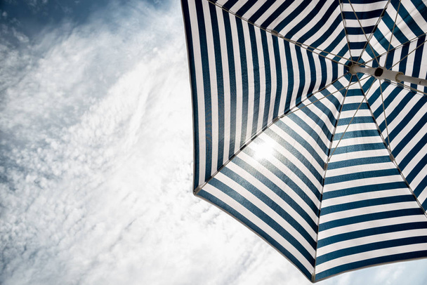 Beach umbrella on sunny day - Zdjęcie, obraz