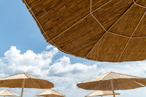 Beach umbrella on sunny day - Foto, afbeelding