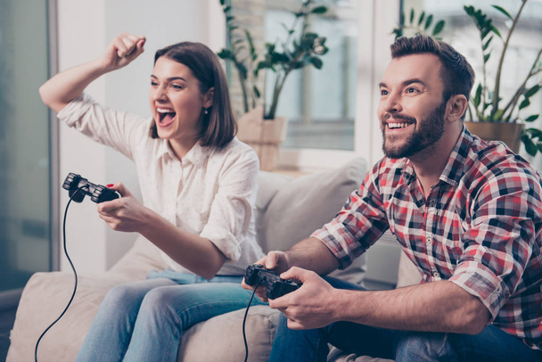 Two excited happy lovers playing video game - Foto, immagini